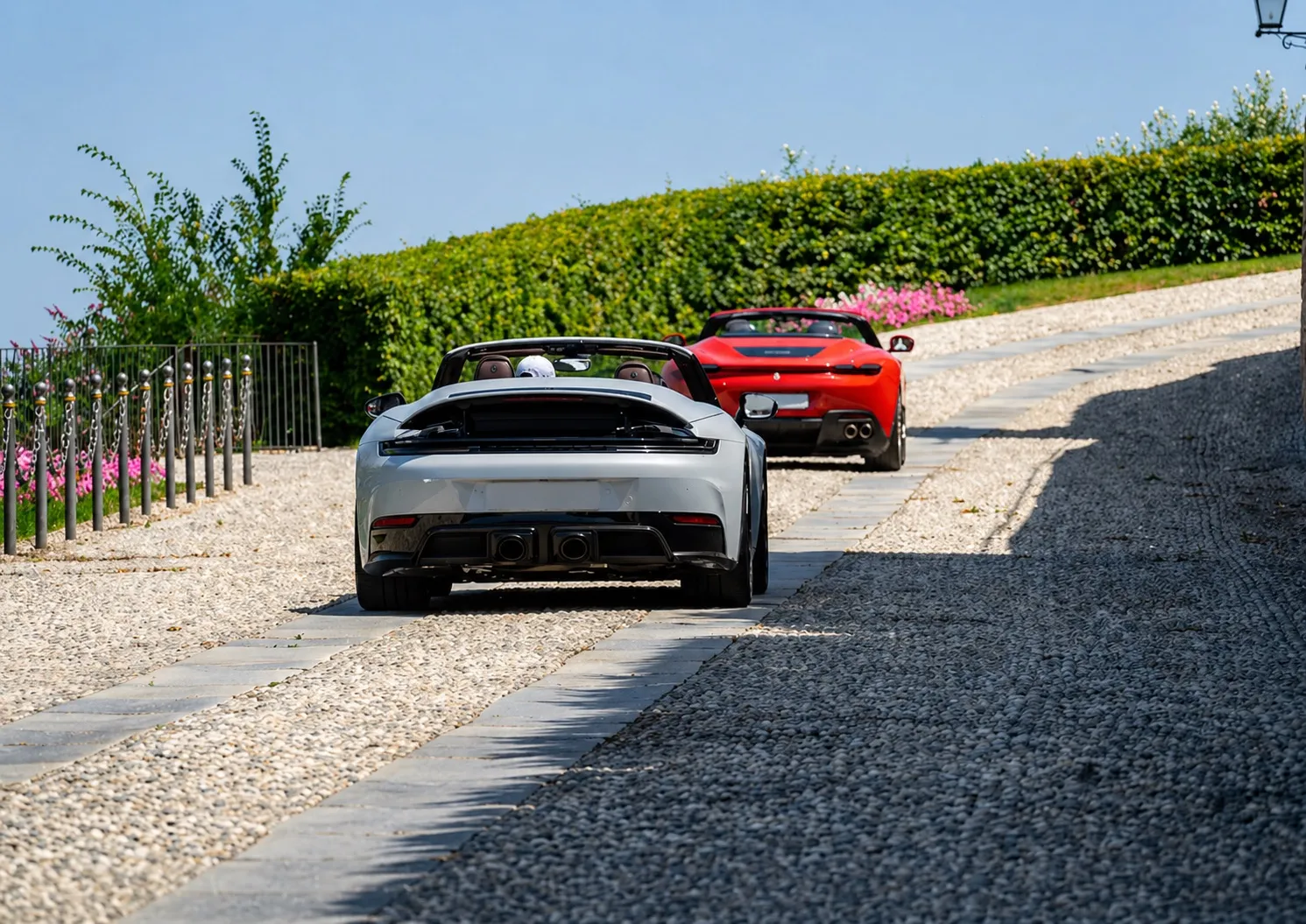 Supercars arriving at a Tuscan estate
